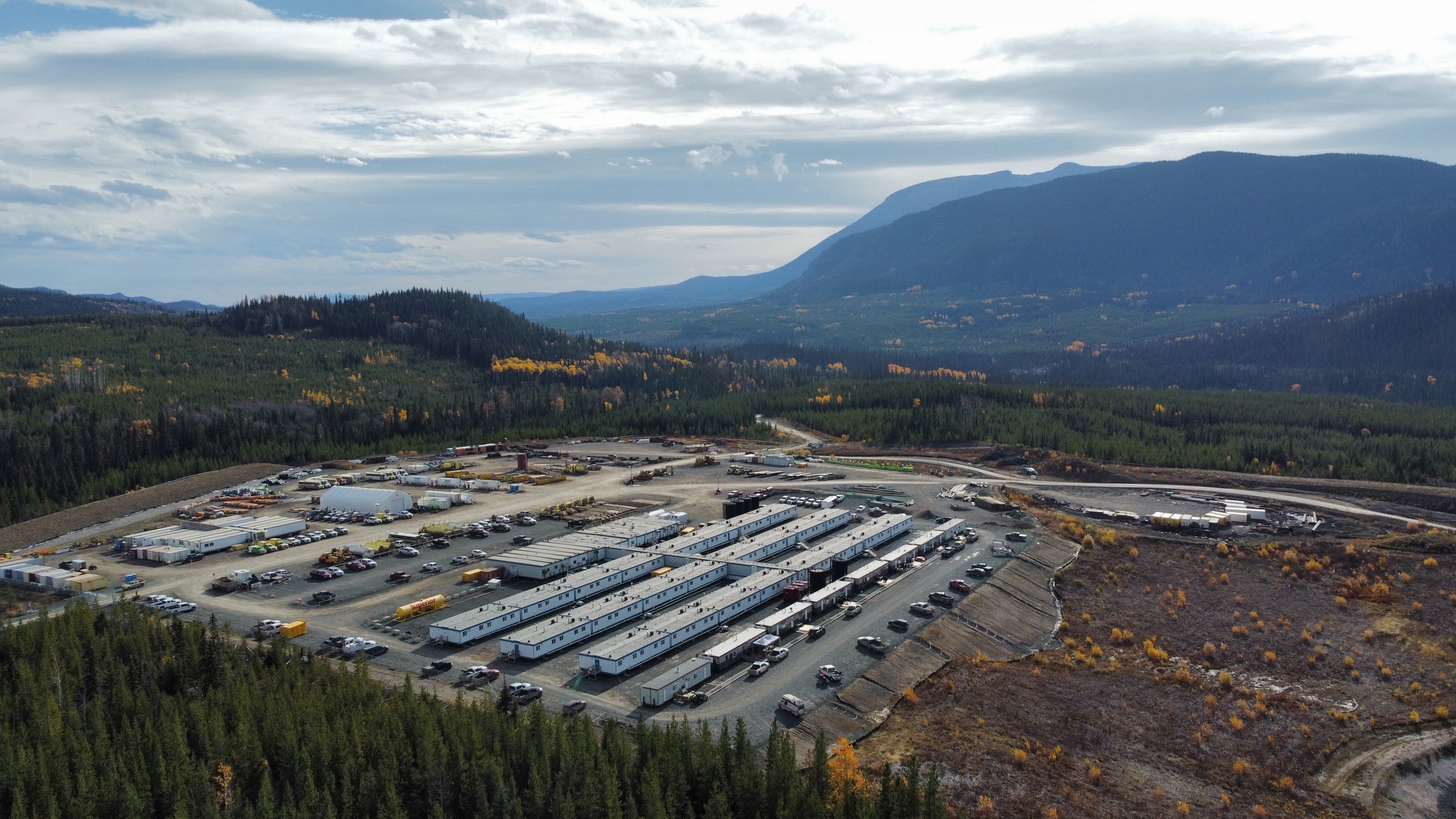 Remote modular camp surrounded by Northern Canadian mountains